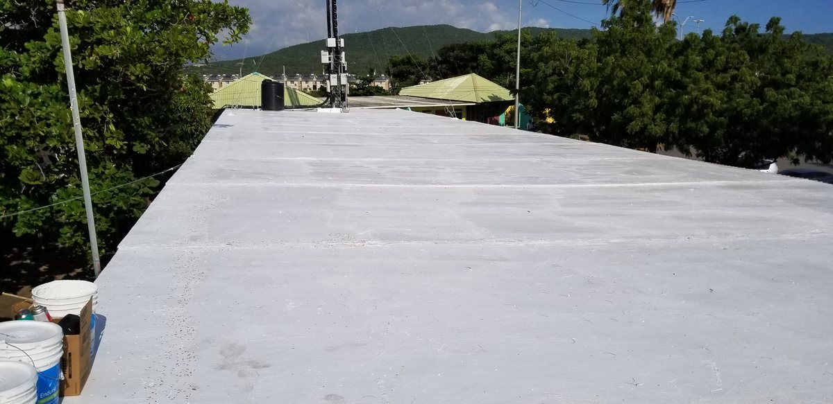 Concrete roof after silicone waterproofing — bright reflective white