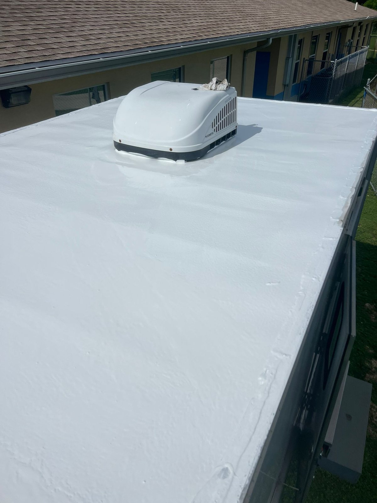 Roof after coating — glossy reflective white silicone finish