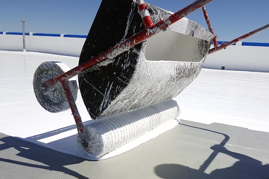 Applying Impermeable 100% Silicone on a roof